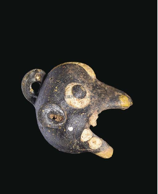 A PHOENICIAN GLASS DOG'S HEAD PENDANT BEAD _ CIRCA 650-450 B.C..jpg